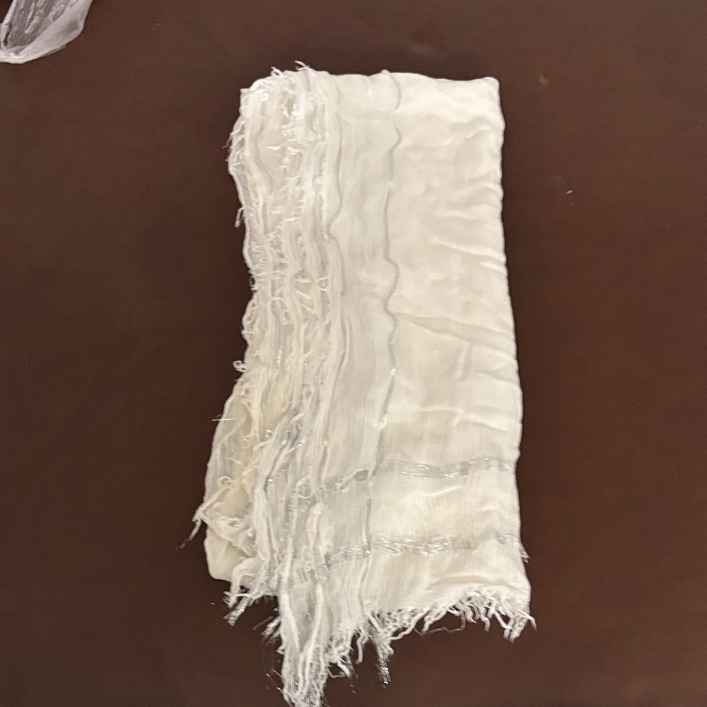 Nice white and glitter scarf. Beautiful for night time holding hair in place.